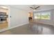 Bright living room with tile floors and ceiling fan at 5340 5Th S Ave, St Petersburg, FL 33707