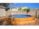 Octagonal pool with wooden deck and steps at 5340 5Th S Ave, St Petersburg, FL 33707