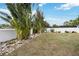 Landscaped backyard with tropical plants at 6628 Keystone Dr, Sarasota, FL 34231