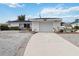 White single-story house with a garage and landscaped yard at 6628 Keystone Dr, Sarasota, FL 34231