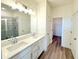 Modern bathroom with double vanity and walk-in shower at 7950 Chandler Lake Ct, Hudson, FL 34667