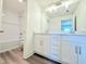 Modern bathroom with double vanity and white subway tile at 7971 Chandler Lake Ct, Hudson, FL 34667