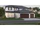Two-story home with a two-car garage, dark brown garage doors, and a light-grey exterior at 1668 Lugano Cir, North Venice, FL 34275
