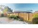 Private backyard with wooden fence and small patio at 1710 Curry Ave # 42, Nokomis, FL 34275