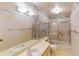 Clean bathroom with shower/tub combo and double vanity at 1710 Curry Ave # 42, Nokomis, FL 34275