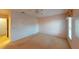 Simple bedroom with ceiling fan and window at 1710 Curry Ave # 42, Nokomis, FL 34275