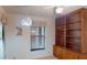 Bedroom featuring a built-in bookcase and a bright window, creating a cozy and functional space at 1710 Curry Ave # 42, Nokomis, FL 34275