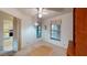 Bedroom area showcasing natural light, carpeted floors and a closet at 1710 Curry Ave # 42, Nokomis, FL 34275