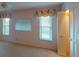 Bright bedroom with carpet flooring, window, and closet for ample storage, creating a peaceful retreat at 1710 Curry Ave # 42, Nokomis, FL 34275
