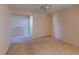 Bright bedroom featuring a ceiling fan and ample closet space at 1710 Curry Ave # 42, Nokomis, FL 34275