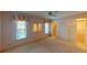 Well-lit bedroom with two windows, a mirror and built-in closet at 1710 Curry Ave # 42, Nokomis, FL 34275