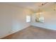 Bright dining area with a view into the kitchen and a chandelier at 1710 Curry Ave # 42, Nokomis, FL 34275