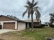 Side view of a single-story house with a carport and landscaping at 1710 Curry Ave # 42, Nokomis, FL 34275