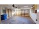 Spacious garage with a ceiling fan and ample storage shelving, ideal for parking and organization at 1710 Curry Ave # 42, Nokomis, FL 34275