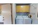 Laundry room with washer, dryer, and cabinets at 1710 Curry Ave # 42, Nokomis, FL 34275