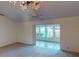 Cozy living room with plush carpet and a view into a sunroom, offering comfortable living and natural light at 1710 Curry Ave # 42, Nokomis, FL 34275