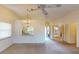 Living room with kitchen pass-through and access to other rooms at 1710 Curry Ave # 42, Nokomis, FL 34275