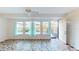 Sunroom with access to the backyard and patterned tile floor at 1710 Curry Ave # 42, Nokomis, FL 34275