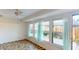 Sunroom with tiled floor and access to the backyard at 1710 Curry Ave # 42, Nokomis, FL 34275