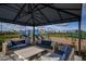 Relax in this community gazebo, featuring comfortable seating and a playground view at 17138 Savory Mist Cir, Bradenton, FL 34211