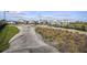 Community bike track with rolling hills, landscaping, and black metal fence at 17150 Savory Mist Cir, Bradenton, FL 34211