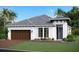 Charming single-story home featuring a two-car garage, well-manicured lawn, and tasteful landscaping at 17150 Savory Mist Cir, Bradenton, FL 34211