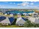 Aerial view of community homes surrounding central lake at 18024 Cherished Loop, Bradenton, FL 34211
