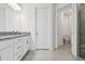 Modern bathroom with granite countertops, tile flooring, and a view into the walk-in shower and toilet at 18024 Cherished Loop, Bradenton, FL 34211