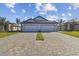 New construction home with long driveway and attached two-car garage at 18024 Cherished Loop, Bradenton, FL 34211