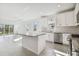 Open floor plan kitchen featuring an island with gray countertops at 18024 Cherished Loop, Bradenton, FL 34211