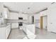 Bright kitchen featuring white cabinets, granite countertops, and stainless appliances at 18024 Cherished Loop, Bradenton, FL 34211