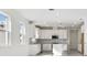 Modern kitchen with white cabinets, stainless steel appliances, and an open layout great for entertaining at 18024 Cherished Loop, Bradenton, FL 34211