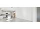 Open-concept space showcases the seamless flow from living area to kitchen with modern finishes and ample light at 18024 Cherished Loop, Bradenton, FL 34211