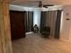 Bedroom featuring neutral curtains, wood-look tile flooring, and a large armoire at 246 176Th E Ave, Redington Shores, FL 33708