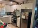 Modern kitchen equipped with stainless steel appliances and ample cabinet space at 246 176Th E Ave, Redington Shores, FL 33708