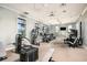 Gym with modern exercise equipment, ample lighting, and scenic outdoor views for fitness at 4720 Sweet Retreat Run, Bradenton, FL 34211