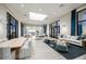 Lounge area with sofas, tables, and large windows that offer ample natural light in a community at 4720 Sweet Retreat Run, Bradenton, FL 34211