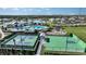 Aerial view of community amenities featuring a pool, clubhouse, tennis court, basketball court and playground at 4720 Sweet Retreat Run, Bradenton, FL 34211