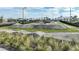 Shot of a community bike park, with undulating terrain, landscaping, and fencing at 4720 Sweet Retreat Run, Bradenton, FL 34211