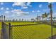 Spacious and well-maintained community dog park with lush green grass at 7526 Backlight Ln, Sarasota, FL 34240