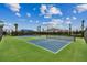 Brightly colored community tennis and pickleball courts for active lifestyle enthusiasts under blue skies at 7526 Backlight Ln, Sarasota, FL 34240
