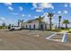 View of the community clubhouse with ample parking including handicap parking at 7530 Backlight Ln, Sarasota, FL 34240