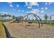 Fun community playground featuring swings, slides, and climbing structures at 7534 Backlight Ln, Sarasota, FL 34240