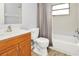Bathroom with wood vanity, shower/tub combo at 7450 35Th N St # 1604, Pinellas Park, FL 33781