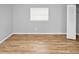 Spacious bedroom with light gray walls and wood flooring at 7450 35Th N St # 1604, Pinellas Park, FL 33781