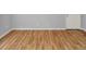 Simple bedroom with wood-look floors and door at 7450 35Th N St # 1604, Pinellas Park, FL 33781