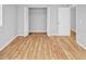 Bedroom with wood-look floors and access to bathroom at 7450 35Th N St # 1604, Pinellas Park, FL 33781
