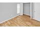 Bedroom with light wood-look floors and a double door closet at 7450 35Th N St # 1604, Pinellas Park, FL 33781