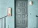 Gray front door and light teal stucco walls at 7450 35Th N St # 1604, Pinellas Park, FL 33781