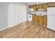 Kitchen with wood cabinets, white appliances and access to patio at 7450 35Th N St # 1604, Pinellas Park, FL 33781